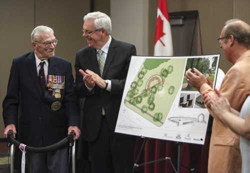(Left to right) George Peterson, the sole surviving member of the Arden Seven, Premier Greg Selinger and Mayor Sam Katz applaud following the unveiling of plans for a new park plaza in honour of seven comrades who grew up on Arden Ave. in Winnipeg. They volunteered, fought and were captured during the Battle of Hong Kong during the Second World War in 1941. The Arden Seven Interpretive Plaza, to be located in Jules Mager Park in St. Vital, commemorates comrades Fred Abrahams, twins Morris and George Peterson, and brothers Alfred, Edward and Harry Shayler, all of whom survived the battle of Hong Kong. Friday, August 16, 2013.  (OLIVER SACHGAU) (JESSICA BURTNICK/WINNIPEG FREE PRESS)