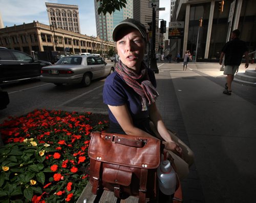 "Street Counsellor" Kristy Rebenchuk poses on a Portage ave bench. She's working the street counselling homeless residents fr the Downtown BIZ's Community Homeless Assistance Team. See story. August 16, 2013 - (Phil Hossack / Winnipeg Free Press)