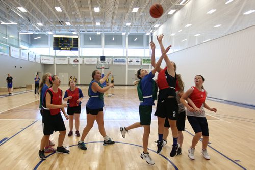 Brandon Sun 16082013 Girls take part in a four-on-four-on-four basketball match during the Brandon Bobcats Girls Performance Camp at the BU Healthy Living Centre on Friday. (Tim Smith/Brandon Sun)