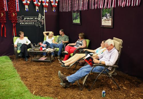 Brandon Sun 16082013 Horse owners with Price Performance Horses from Wisconsin  relax at their stable during the Arabian & Half-Arabian Championship Horse Show at the Keystone Centre on Friday.  (Tim Smith/Brandon Sun)