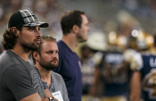 Winnipeg Jets' defencemam Zach Bogosian takes in the Blue Bombers loss to the Hamilton Tiger-Cats at Investors Group Field Friday night.  130816 - Friday, August 16, 2013 - (Melissa Tait / Winnipeg Free Press)