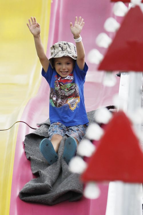 August 18, 2013 - 130818  -   Paul Chartrand (4) gets excited on a slide at Stonewall's Quarry Days Sunday, August 18, 2013. John Woods / Winnipeg Free Press
