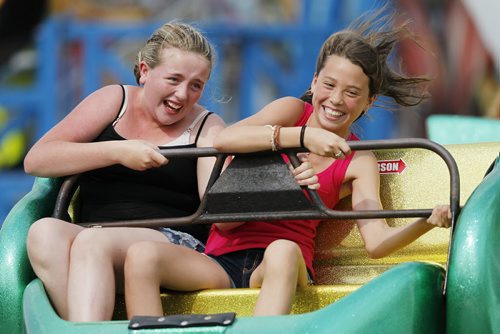 August 18, 2013 - 130818  -   Caitlin (L) and Kali (did not want last names used) ride the Sizzler at Stonewall's Quarry Days Sunday, August 18, 2013. John Woods / Winnipeg Free Press