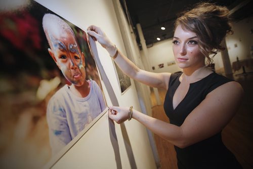 August 19, 2013 - 130819  -  Tracy Tomchuk, a fine arts graduate, is photographed at her photography exhibit at  Frame Arts Warehouse Monday, August 19, 2013. Tomchuk went to work in a Tanzanian orphanage and take photographs and now wants to get her nursing degree and return to help. John Woods / Winnipeg Free Press