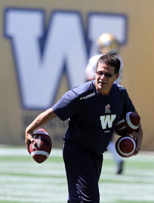 In pic new Offensive Coordinator  Marcel Bellefeuille has the ball  and has chosen  #15 Max Hall as starting  QB , his back up #4 Buck Pierce and third QB #18 Justin Goltz.  - Hall and  Pierce took most of the reps at a sweltering Investor's Group Filed practice  KEN GIGLIOTTI / Aug 20 2013 / WINNIPEG FREE PRESS