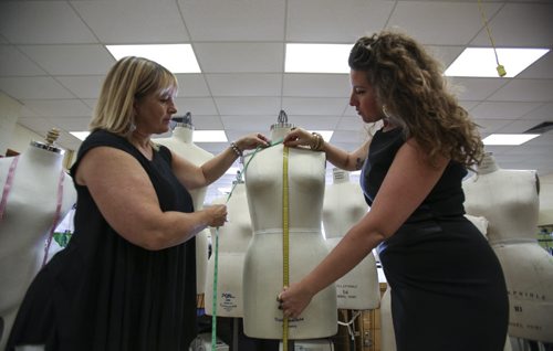 Instructors Denise Miller (right) and Karen Luchak are in search of students to join the one-of-a-kind Fashion Technology program on offer at Murdoch MacKay Collegiate. Tuesday, August 20, 2013. (JESSICA BURTNICK/WINNIPEG FREE PRESS)