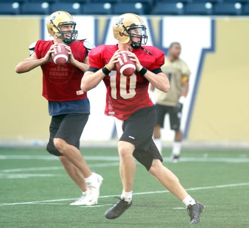 Quarterback battle between incumbent Marc Paquette (no #)  and newly recruited Jordan Yantz (#10). Sometimes these quarterback battles in training camp can be heated, but these two have taken it in stride and use the competition in training camp to better themselves. So far theyve both proven to be worthy of the position. Kyle Jahns story.. (he had the number 10 jersey on Marc, but I've confimed the id is correct on this pic..... August 20, 2013 - (Phil Hossack / Winnipeg Free Press)
