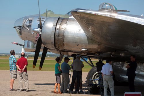 Brandon Sun Visitors line up to tour the interior of a B-17 Flying Fortress, one of ten airworthy planes of this type, at the Commonwealth Air Training Plan Musem, on Tuesday afternoon. The plane will be on display from noon to 2:30 p.m., today and Thursday with scheduled flights for paying customers later in the afternoon. SEE LINDSEY (Bruce Bumstead/Brandon Sun)