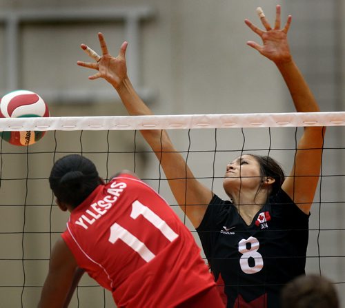 Team Canada's Jamie Thibeault misses a bolch against Peru's #11 Clarivett Yllescas in exhibition volleyball at U of W Tuesday evening. August 20, 2013 - (Phil Hossack / Winnipeg Free Press)