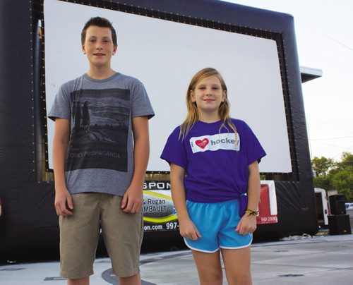 Canstar Community News Aug. 15, 2013 - Transcona residents Ben and Jolene Galagan are shown in front of the big screen prepared to show Beethoven's Christmas Adventure at Transcona Centennial Square on Aug. 15. The siblings were extras in the film. (DAN FALLOON/CANSTAR COMMUNITY NEWS/HERALD)