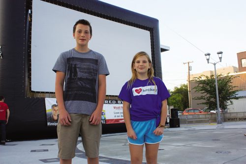 Canstar Community News Aug. 15, 2013 - Transcona residents Ben and Jolene Galagan are shown in front of the big screen prepared to show Beethoven's Christmas Adventure at Transcona Centennial Square on Aug. 15. The siblings were extras in the film. (DAN FALLOON/CANSTAR COMMUNITY NEWS/HERALD)