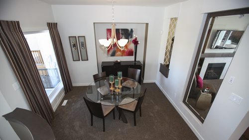(Dining room) This A&S Homes show home located at 10 Tychonick Bay in Kildonan Green features 3 bedrooms, two and a half bathrooms, and modern open living spaces on the main floor. Wednesday, August 21, 2013. (JESSICA BURTNICK/WINNIPEG FREE PRESS)