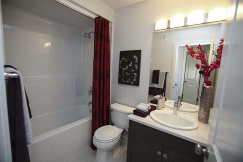 (Second four-piece bathroom) This A&S Homes show home located at 10 Tychonick Bay in Kildonan Green features 3 bedrooms, two and a half bathrooms, and modern open living spaces on the main floor. Wednesday, August 21, 2013. (JESSICA BURTNICK/WINNIPEG FREE PRESS)