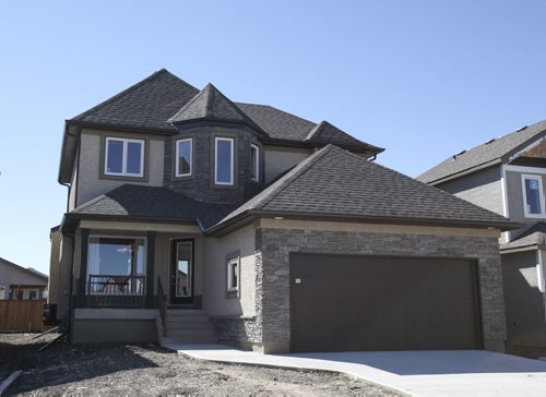 (Exterior) This A&S Homes show home located at 10 Tychonick Bay in Kildonan Green features 3 bedrooms, two and a half bathrooms, and modern open living spaces on the main floor. Wednesday, August 21, 2013. (JESSICA BURTNICK/WINNIPEG FREE PRESS)