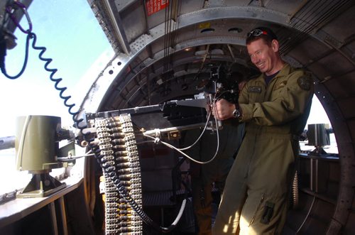 Brandon Sun Helicopter pilot Tim Rudolph of the 3CFFTS squadron from Portage la Prairie takes aim on the 50 cal. machine gun in the waist section of the Sentimental Journey B-17 on Wednesday morning. (Bruce Bumstead/Brandon Sun)
