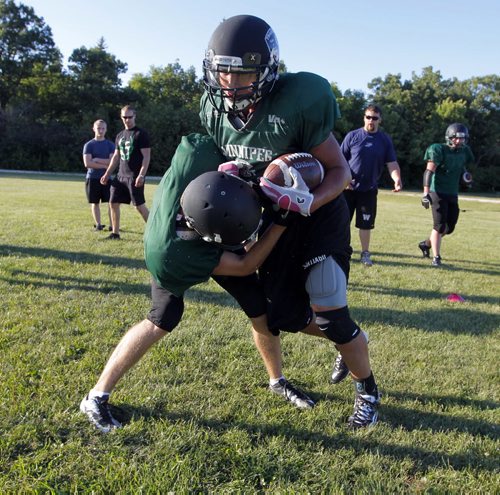 Vincent Massy Trojans highschool football team practicing before they leave this weekend for Hawaii for a football trip. BORIS MINKEVICH / WINNIPEG FREE PRESS. August 21, 2013.