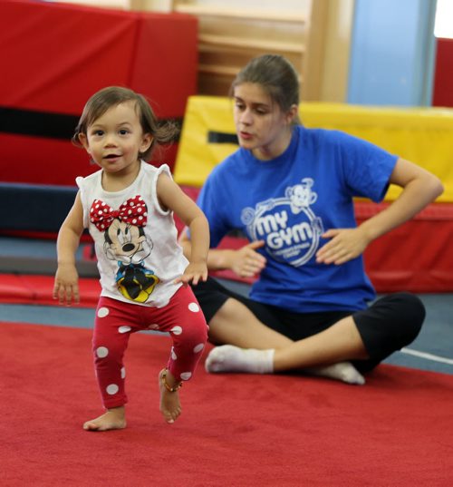 Mahailia Holmes age 19 months dances to music as staff member Lauren Lischka  mimes the moves for the kids. -Childhood Obesity Äì The My Gym location specializes in fitness for infant and young children  - storey by Randy Turner fr 49.8  KEN GIGLIOTTI / Aug 22 2013 / WINNIPEG FREE PRESS