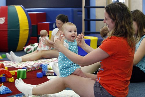 Tara Smith with her daughter Rowan age 6 months  at Little Bundles exercise  class  Childhood Obesity Äì The My Gym location specializes in fitness for infant and young children  - storey by Randy Turner fr 49.8  KEN GIGLIOTTI / Aug 22 2013 / WINNIPEG FREE PRESS