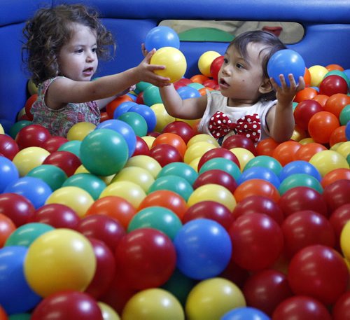 Brooke Babakhanians  age 18 months plays in ball pit with righ Mahailia Homes -Childhood Obesity Äì The My Gym location specializes in fitness for infant and young children  - storey by Randy Turner fr 49.8  KEN GIGLIOTTI / Aug 22 2013 / WINNIPEG FREE PRESS