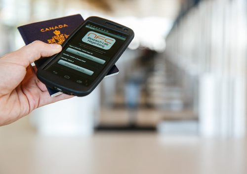 The new Canadian passports include a security chip in the cover that can be read by any near field communication (NFC) application on a smartphone.  See story by Oliver Sachgau 130821 - Wednesday, August 21, 2013 - (Melissa Tait / Winnipeg Free Press)
