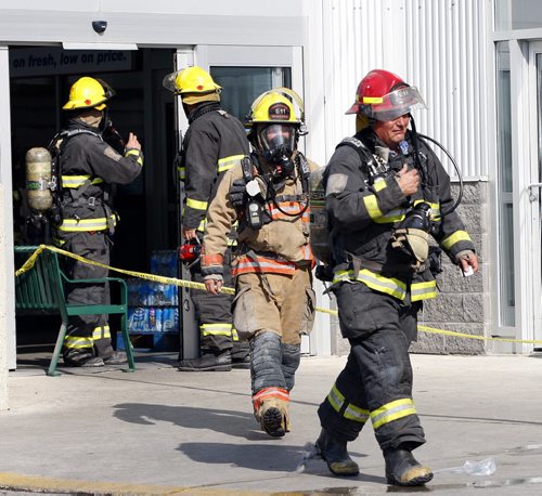 Fire fighters put out small fire in St. James St Superstore -A small fire broke out send staff and customers fleeing the smokey St. James St Superstore , one customer Maria Fostes said she saw flame & smoke  coming from the electronics area , where TV and electronic games were on display . KEN GIGLIOTTI / Aug 23 2013 / WINNIPEG FREE PRESS