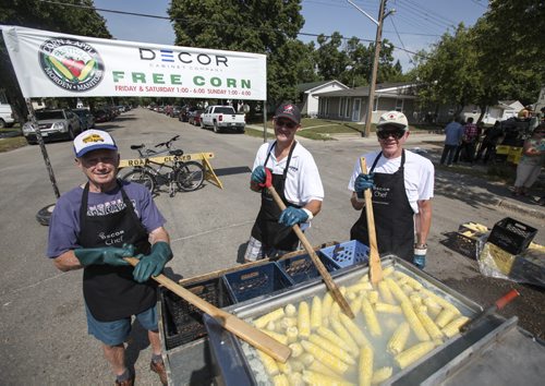 Bill Zacharias (left), who has taken part in the festival for the past 19 years, stirs up some boiling hot corn with Rick Rempel (centre) and Jack Zacharias (right). Established in 1967, the Morden Corn and Apple Festival is the town's chief attraction, and is always held in the fourth week of August. Friday, August 23, 2013. (JESSICA BURTNICK/WINNIPEG FREE PRESS)