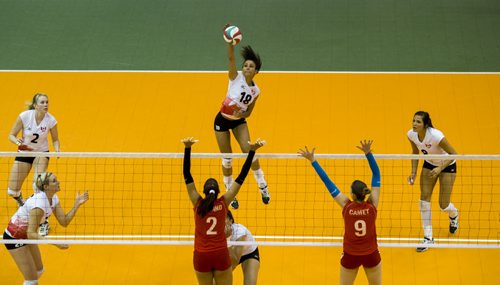 130823 Winnipeg - DAVID LIPNOWSKI / WINNIPEG FREE PRESS (August 23, 2013) Shanice Marcelle (#18) of the Winnipeg-based National Canadian Women's Volleyball Team concentrates on the spike against the Peruvian Women's National Team at the Investors Group Athletic Centre Friday night.