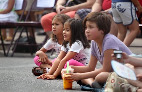 Kids enjoy the entertainment on stage  during the 5th annual Winnipeg Chinatown Street Festival Saturday afternoon in Chinatown. See Oliver Sachgau's story.  August  24, 2013 Ruth Bonneville Winnipeg Free Press