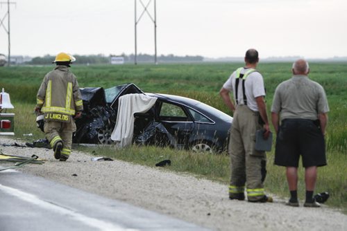 A crash involving two vehicles occurred on Highway 3 about 2-kms West of Brunkild, Man. today around 4 p.m. One infant and one child were among the victims. Two people were dead at the scene, and the others transported to hospital. Saturday, August 24, 2013. (JESSICA BURTNICK/WINNIPEG FREE PRESS)
