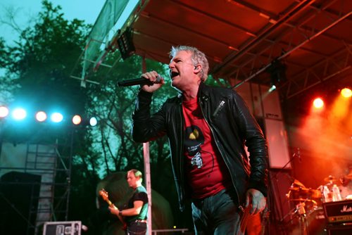 Brandon Sun 24082013 Lead singer Alan Frew of Canadian rockers Glass Tiger belts out a song as the band performs in front of thousands of fans in Wasagaming during a free concert in honour of Riding Mountain National Park's 80th Anniversary on Saturday evening.  (Tim Smith/Brandon Sun)