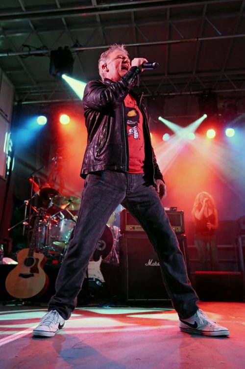 Brandon Sun 24082013 Lead singer Alan Frew of Canadian rockers Glass Tiger belts out a song as the band performs in front of thousands of fans in Wasagaming during a free concert in honour of Riding Mountain National Park's 80th Anniversary on Saturday evening.  (Tim Smith/Brandon Sun)