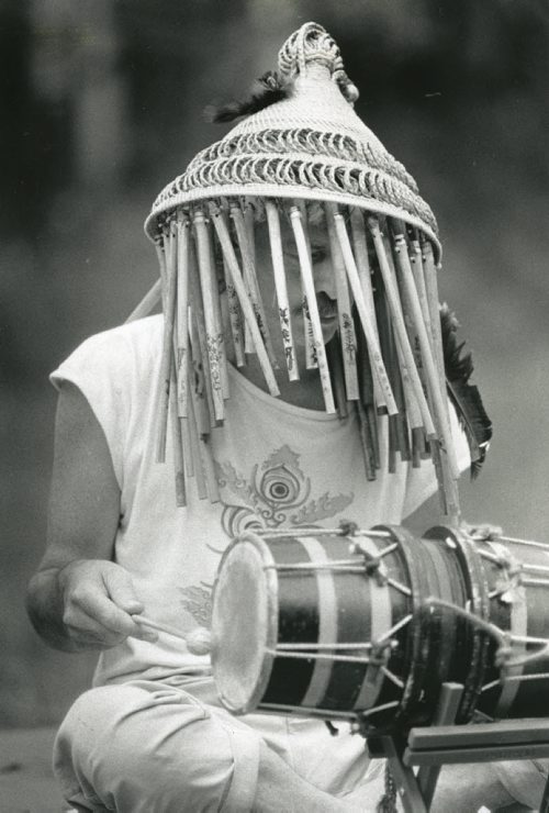40 years of Folk Fest -- A member of Lights in a Fat City plays a drum at the festival. The group played on instruments from Africa, Australia, Burma, Bali, China, Java, India, Japan, Spain, Switzerland, South America and Tibet, alongside custom built devices made from recycled scrap metals and bamboo. July 8, 1989. (KEN GIGLIOTTI/WINNIPEG FREE PRESS ARCHIVES) winnipeg folk festival. fparchives