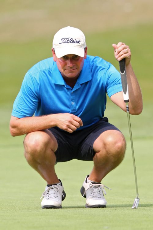 Brandon Sun 24082013 Brandon's Jarod Crane eyes a putt on his way to winning the men's championship at the Tamarack Golf Tournament at Clear Lake Golf Course on a scorching hot Saturday.  (Tim Smith/Brandon Sun)