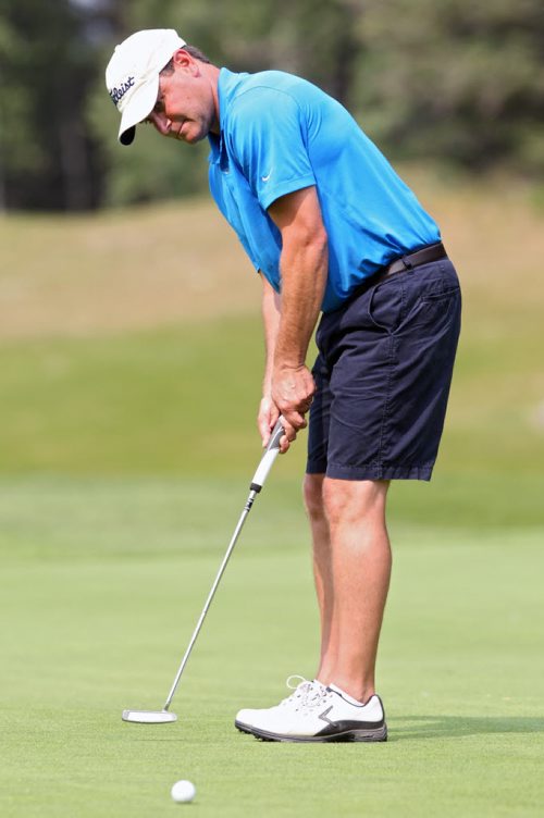 Brandon Sun 24082013 Brandon's Jarod Crane putts on his way to winning the men's championship at the Tamarack Golf Tournament at Clear Lake Golf Course on a scorching hot Saturday.  (Tim Smith/Brandon Sun)