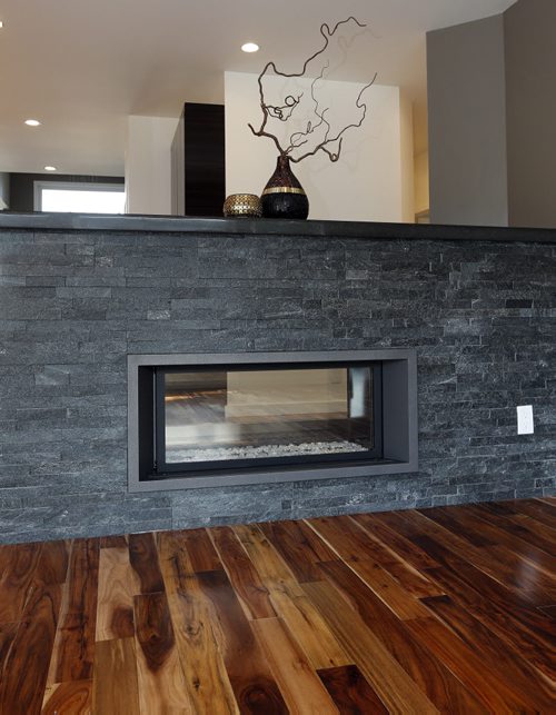 New Homes Äì 50 Van Hull  Way in St. Vital - living room fireplace with tropical walnut flooring throughout  -todd lewys story  KEN GIGLIOTTI / Aug 27 2013 / WINNIPEG FREE PRESS