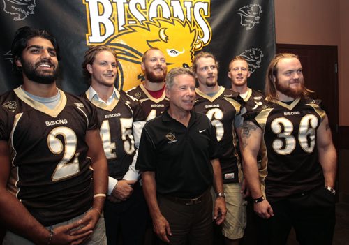 U of M Bisons Football Head Coach Brian Dobie in centre with team captains for the 2013 season, from left, Ranji Atwall, Al Turnbull, Lauren Kroeker, Andrew Smith, Jordan Yantz and Andrew Barry at news conference re: games at the Investors Group Field. Kyle Jahns story Wayne Glowacki / Winnipeg Free Press Aug. 27 2013