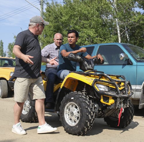 Actors Adam Beach (right) and Brian Markinson, on the set of Arctic Air, receive direction from executive producer Gary Harvey. Season 3, Episode 2 of Arctic Air is currently being filmed at the Brokenhead First Nation near South Beach Casino off Highway 59. Tuesday, August 27, 2013. (BRAD OSWALD) (JESSICA BURTNICK/WINNIPEG FREE PRESS)