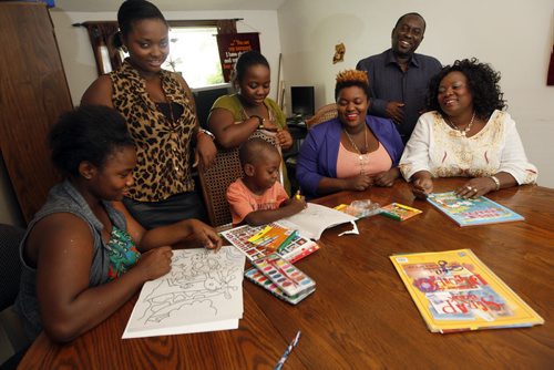 Back to School feature  , new Canadians  going to schol for the first time in Canada Äì The Mulimbwa family - for  LtoR Äì daughter Alliance age 15 , Francine 22  ,Glodi 13, sitting grandson Ben Mulimbwa age 4 (seated colouring will be going to preschool) ,Sylvia  age 25 , father Bahati and mother Esperance Safari Äì Oliver Sachgau story- KEN GIGLIOTTI / Aug 29 2013 / WINNIPEG FREE PRESS