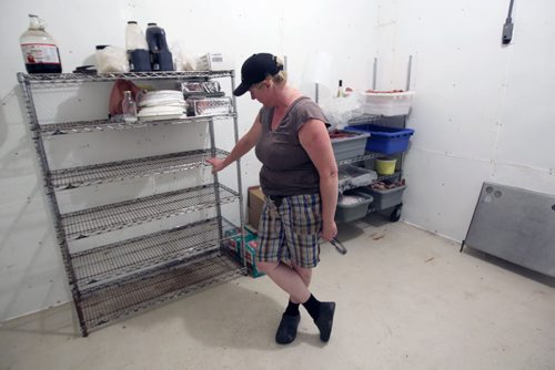 Pam Cavers at her farm near Pilot Mound Manitoba where yesterday they were raided by Provincial Health Inspectors seizing cured meats they make on the farm- This is the storage rack in cooler where the meats were stored that were seized-See Bartley Kives story- August 29, 2013   (JOE BRYKSA / WINNIPEG FREE PRESS)