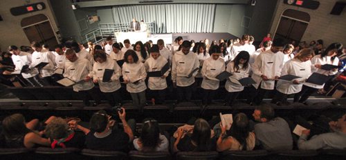 Not even a power outage could stop University of Manitoba students from the Faculty of Dentistry and School of Dental Hygiene from celebrating their white coat ceremony in the Frederic Gaspard Theatre today in the Basic Medical Sciences building. Sixty five students in all from the Faculty of Dentistry (Class of 2017), International Dental Degree Program (Class of 2015) and School of Dental Hygiene (Class of 2015) received their white coats before reciting the Community Code for their family and friends in attendance. Thursday, August 29, 2013. (JESSICA BURTNICK/WINNIPEG FREE PRESS)
