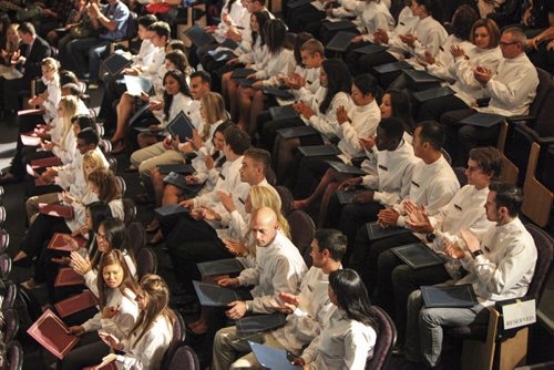 Not even a power outage could stop University of Manitoba students from the Faculty of Dentistry and School of Dental Hygiene from celebrating their white coat ceremony in the Frederic Gaspard Theatre today in the Basic Medical Sciences building. Sixty five students in all from the Faculty of Dentistry (Class of 2017), International Dental Degree Program (Class of 2015) and School of Dental Hygiene (Class of 2015) received their white coats before reciting the Community Code for their family and friends in attendance. Thursday, August 29, 2013. (JESSICA BURTNICK/WINNIPEG FREE PRESS)