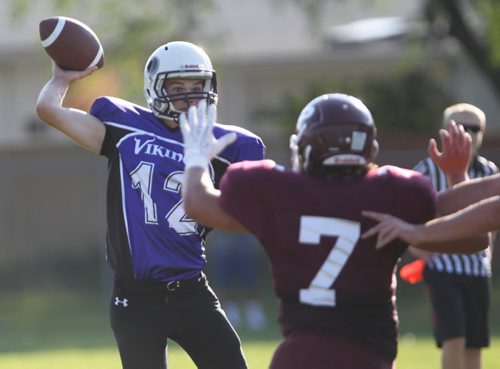Brandon Sun Vikings quarterback Thomas Moroz looks down field for a pass during Thursday's exhibition football game against the Crusaders at Vincent Massey. (Bruce Bumstead/Brandon Sun)