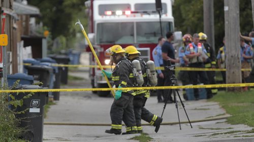 Emergency personnel in the back lane behind a duplex in the 900 block of Selkirk Ave.between Sinclair St. and Battery St. after suspicious fluid in bottles was found in the back yard of a residence. Winnipeg Fire Fighters walk to retrieve the items. Selkirk Ave. was blocked to vehicles and pedestrians during the incident. Wayne Glowacki / Winnipeg Free Press Aug. 30  2013