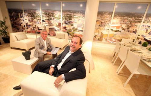 Realtor Gary Bachman and Dan Edwards of Creswin show off a display suite for the new office condo tower on main street. THe display features a wall to wall simulated view to the west of the project. Bart Kives story.  August 30, 2013 - (Phil Hossack / Winnipeg Free Press)