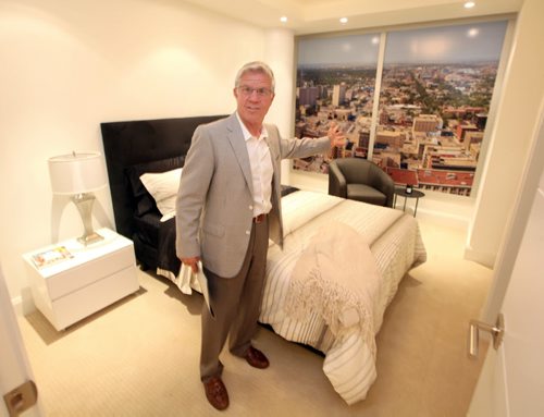 Gary Bachman shows off a spare bedroom in a display suite for the new office condo tower on main street. Bart Kives story.  August 30, 2013 - (Phil Hossack / Winnipeg Free Press)