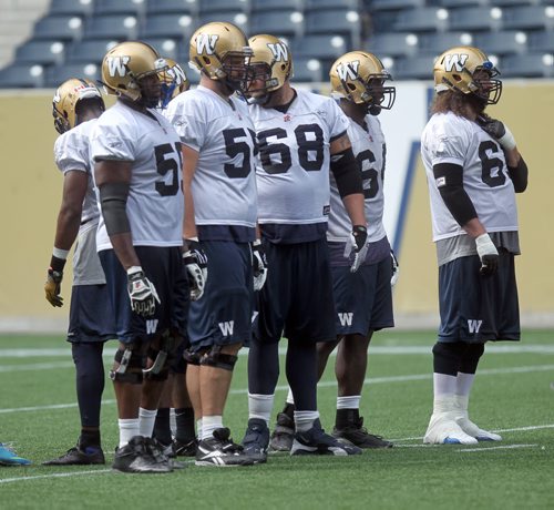 Bomber Offensive Line Friday at the morning workout. Ed Tait story. August 30, 2013 - (Phil Hossack / Winnipeg Free Press)