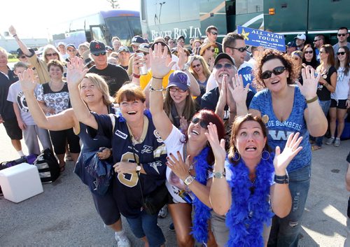 Faithful, longstanding Winnipeg  Blue Bomber fans pray for a win in this weekends LabourDay Classic game against against the Saskatchewan Roughriders as a large group board a bus to Regina Saturday morning with All Star Tours.  August  31,, 2013 Ruth Bonneville Winnipeg Free Press
