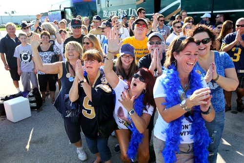 Faithful, longstanding Winnipeg  Blue Bomber fans pray for a win in this weekends Labour Day Classic game against against the Saskatchewan Roughriders as a large group board a bus to Regina Saturday morning with All Star Tours.  August  31,, 2013 Ruth Bonneville Winnipeg Free Press