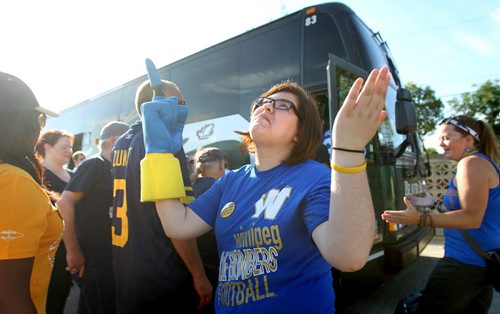Jessica Bradley is hopeful as she points towards heaven just before getting on a All Star Tours Bus with a group of Faithful, longstanding Winnipeg  Blue Bomber fans  as they head to Regina for this weekends Labour Day Classic game against the Saskatchewan Roughriders Saturday morning.  August  31,, 2013 Ruth Bonneville Winnipeg Free Press