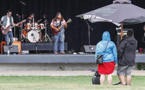 A bit of rain falling on Assiniboine Park didn't deter concert-goers from attending a free rock concert at the Lyric Theatre. Organized by Karen and Floyd Wiebe, parents of the late TJ Wiebe who got mixed up in drug culture at a young age. The concert featured a number of guest bands, including Recovered (pictured), who had an anti-drug message. Saturday, August 31, 2013. (BILL REDEKOP) (JESSICA BURTNICK/WINNIPEG FREE PRESS)